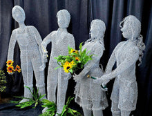 Chicken Wire sculptures of Full size People Gardeners.